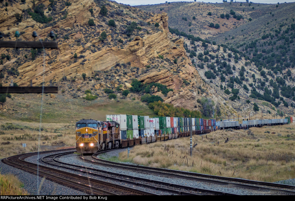 UP 6831 leads a westbound stack train down Echo Canyon